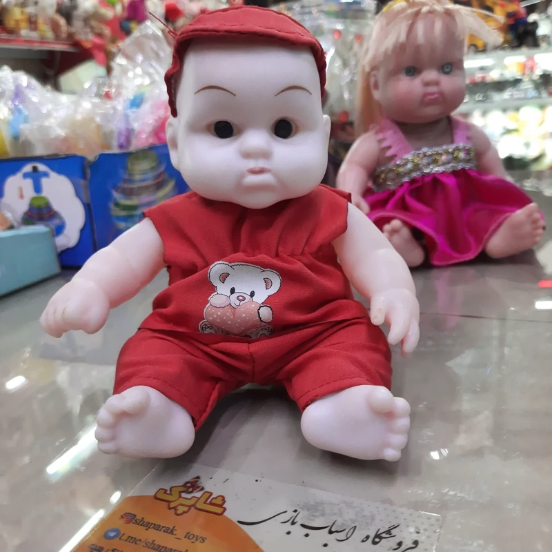 عروسک  پسر موزیکال نشسته