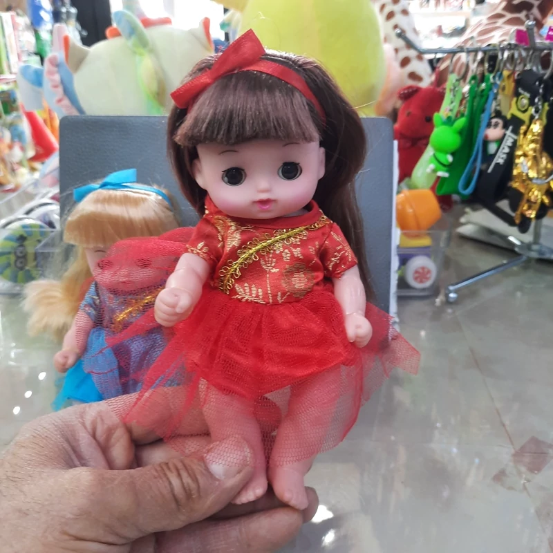 عروسک نشسته صدا دار چشم متحرک  دامن تور